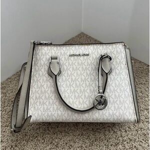 101/2” x 7” very cute Michael Kors purse.